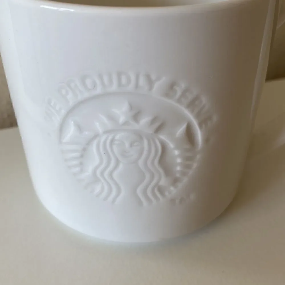 Starbucks 2014 White Embossed Coffee Cup Mug 12oz
